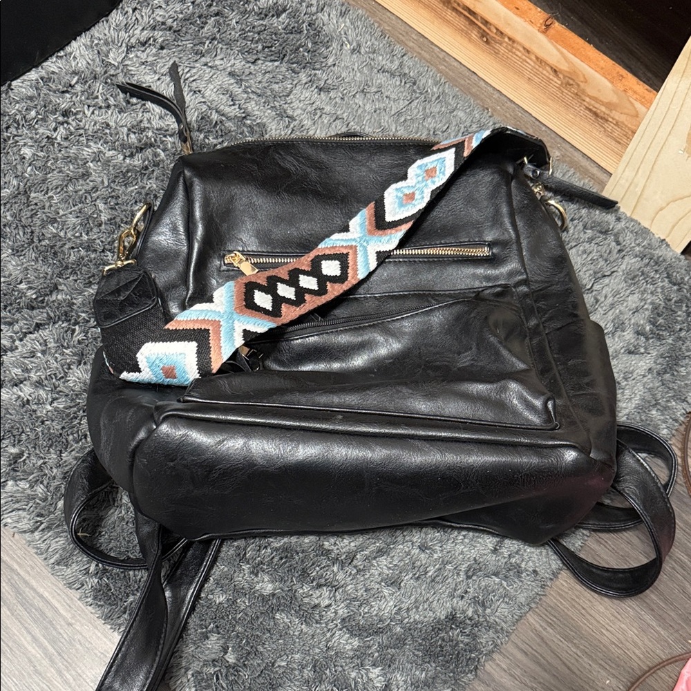 Black Leather Backpack With Patterned Strap - image 1
